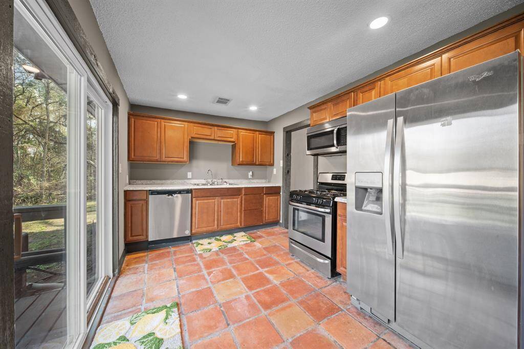 Kitchen with large windows and sliding glass doors