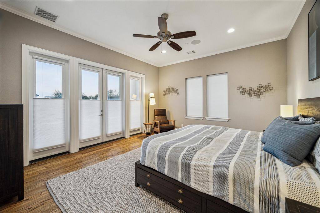 Luxurious third-floor primary bedroom with a private balcony.