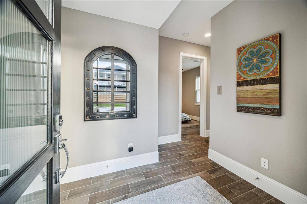Welcoming ground-floor entry with stylish tile flooring and contemporary finishes.