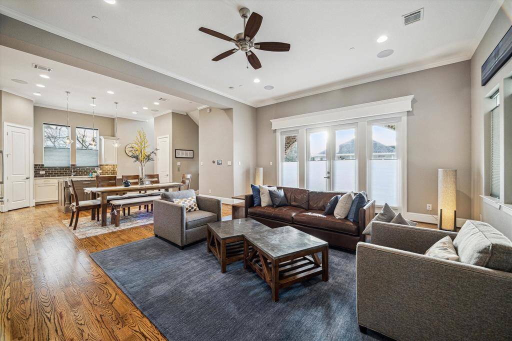Second floor living spaces features 11' ceilings and a spacious balcony.