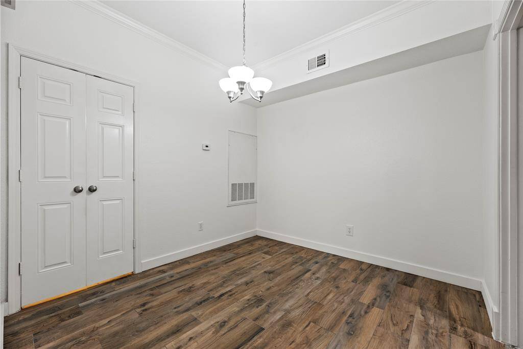 Dining Room area with upgraded light fixture **2255 Braeswood Park Unit 240, Houston, TX 77030**