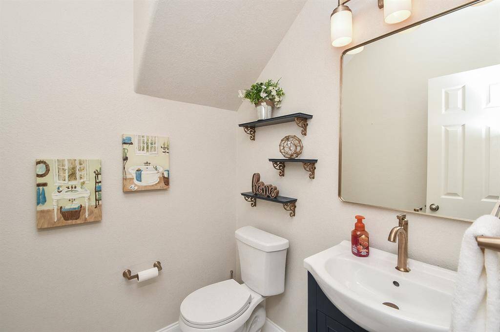 The powder room includes new vanity along with new fixtures, toilet, and faucet.