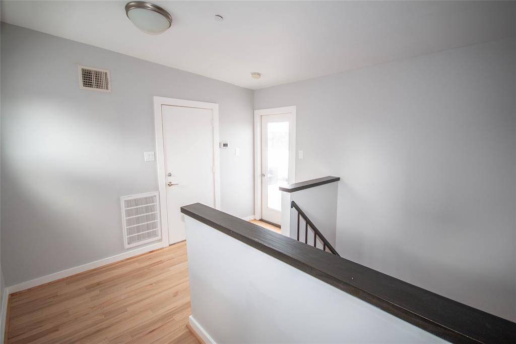 View of foyer from elevator on fifth floor and door takes you to roof terrace