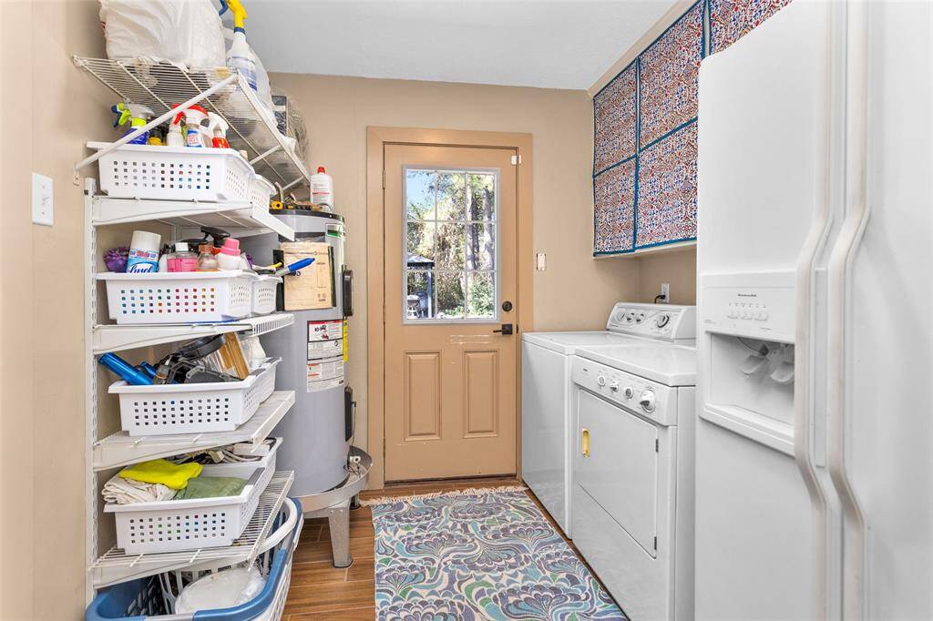 The laundry room is located just off the kitchen.