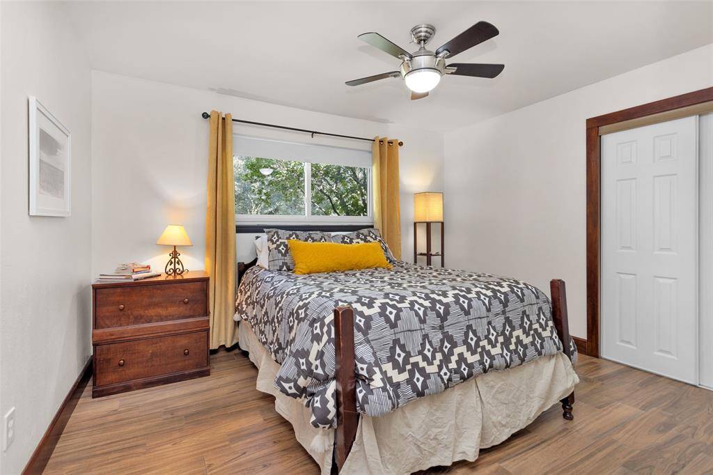 The secondary bedrooms and bathroom feature wood-look tile flooring.