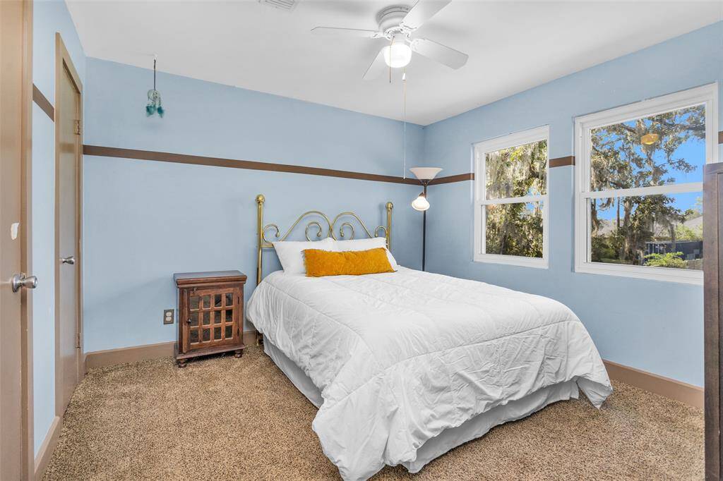 The other secondary bedroom on the second floor offers a view of the backyard.