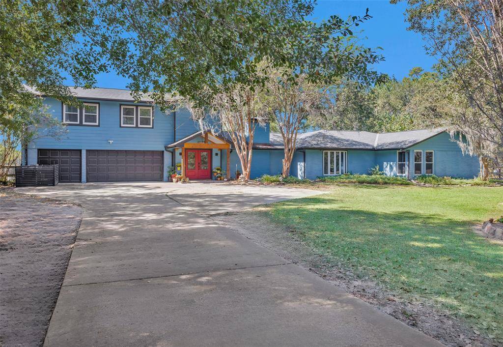 The long driveway and spacious parking area provide ample room for guests to park.