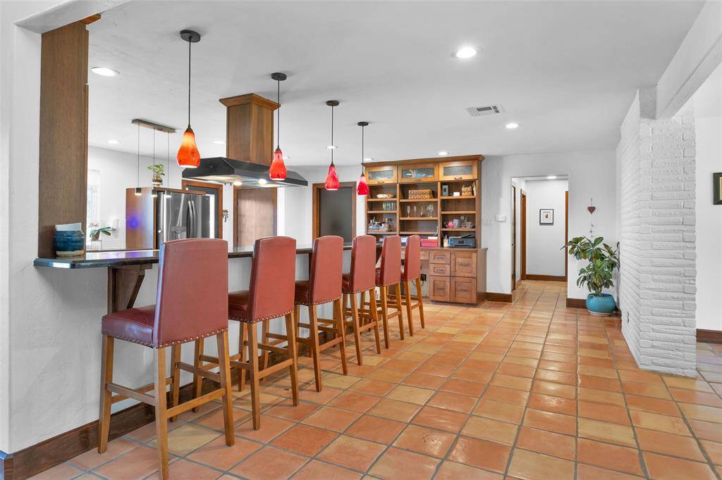 The heart of the home is this fantastic kitchen, featuring a spacious breakfast bar that seats six.