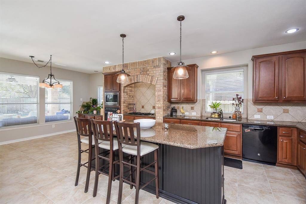 The kitchen has new tile floors