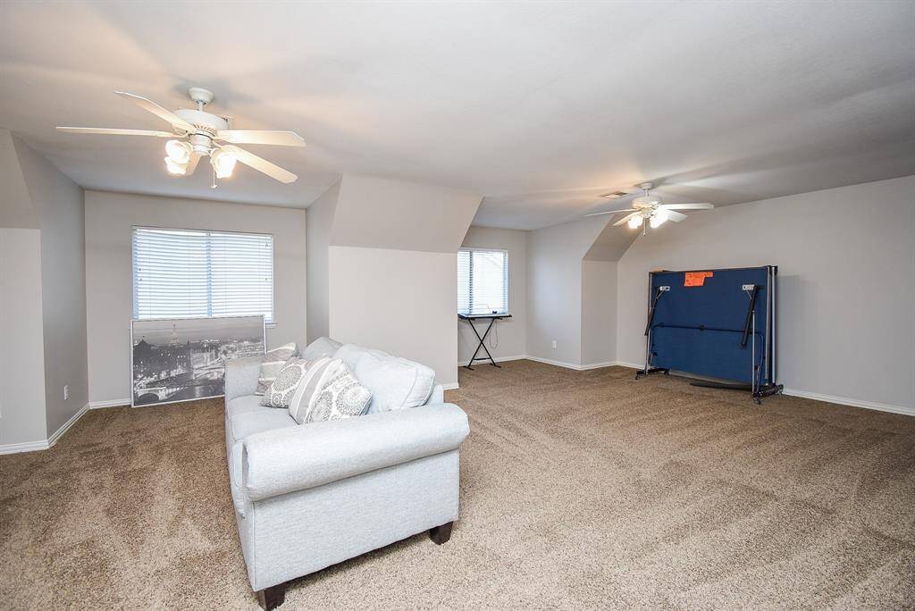 This spacious gameroom is great for entertaining