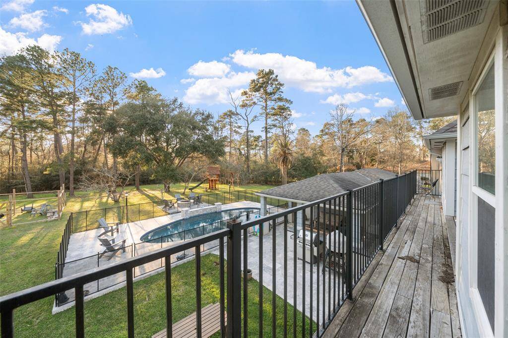 Balcony area upstairs... but look at that backyard (plus there is another 1+ Acre that is still wooded that's yours!