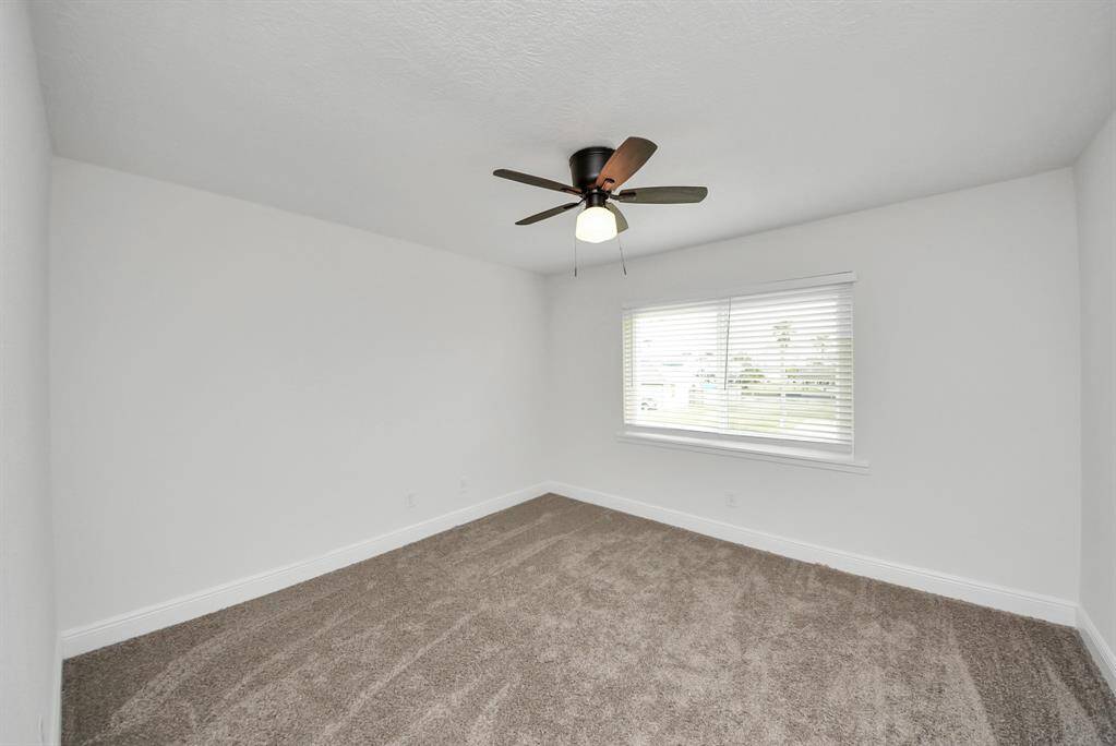 Bed 2...new carpet...new lighting and fan.
