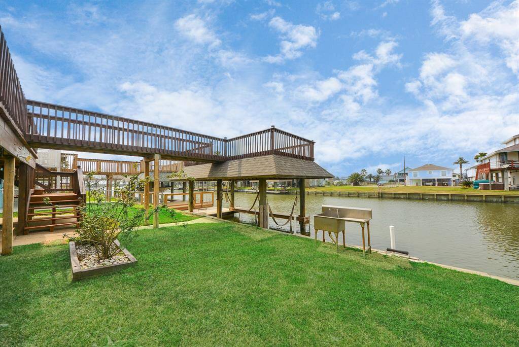 Backyard with a stainless-steel cleaning table for the fish you will be catching.