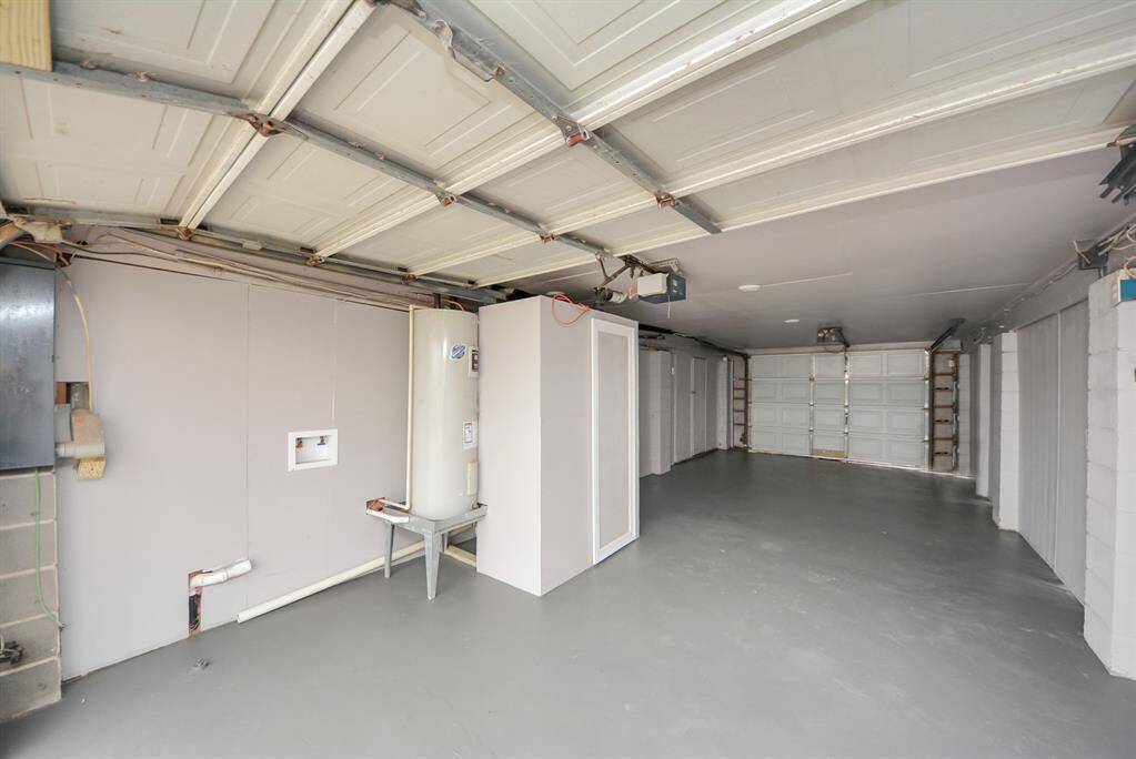 Plenty of storage area for the golf cart, jet ski's, kayaks, and fishing gear. Features a half bath and bonus storage room.