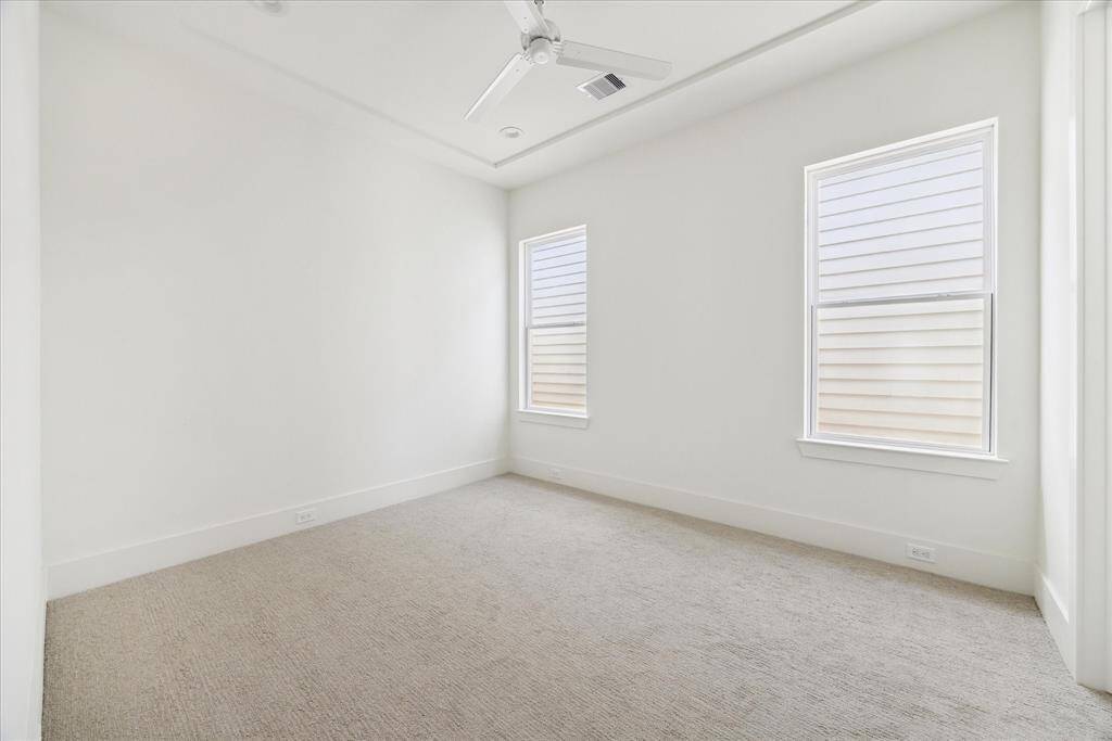 The second of the two guest bedrooms is located at the end of the hallway from the master bedroom, with walk-in closets and attached bathroom designed to provide privacy allowing all your guests to enjoy a comfortable stay in this elegant home.