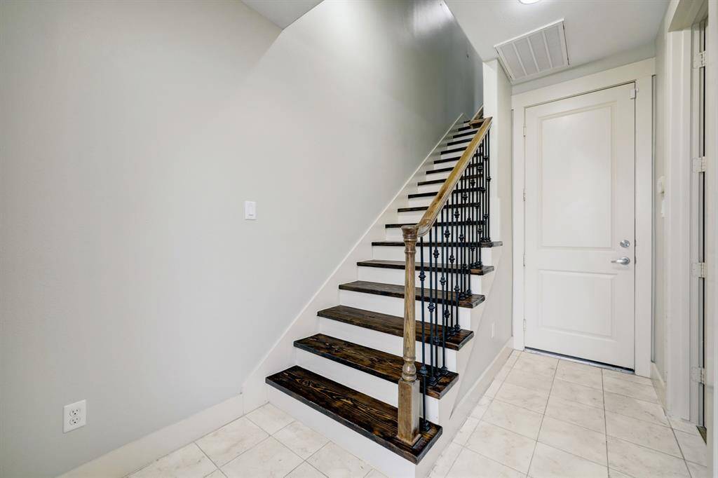 Entrance/ Foyer: 1rst level staircase. Bedroom #1 with ensuite bath located to the right. Back door leads to the two-car attached garage.