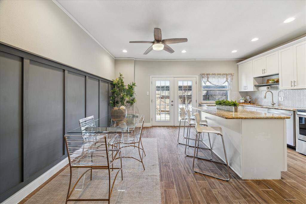 Did I mention how light and bright the kitchen is with only indirect light - all the sun, none of the heat!  The 15 pane French doors open wide for freely access the back patio, utility room and covered parking spaces.