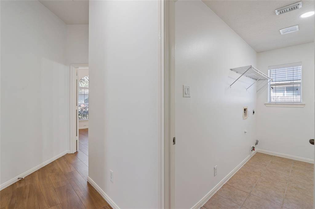 part of laudry room shown. room for freezer on other wall