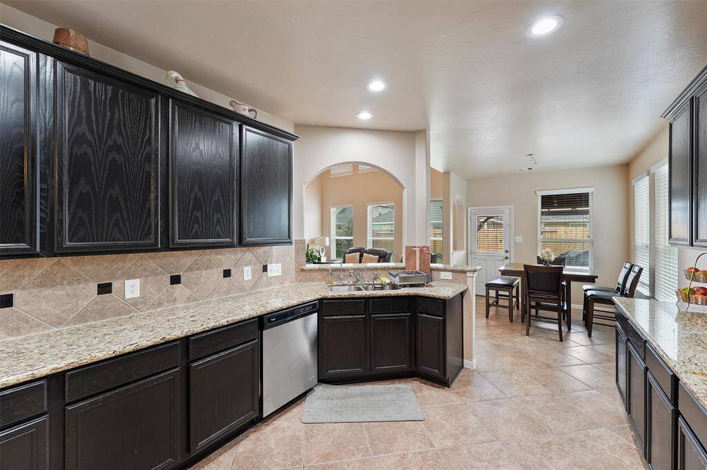 This beautiful kitchen features granite countertops