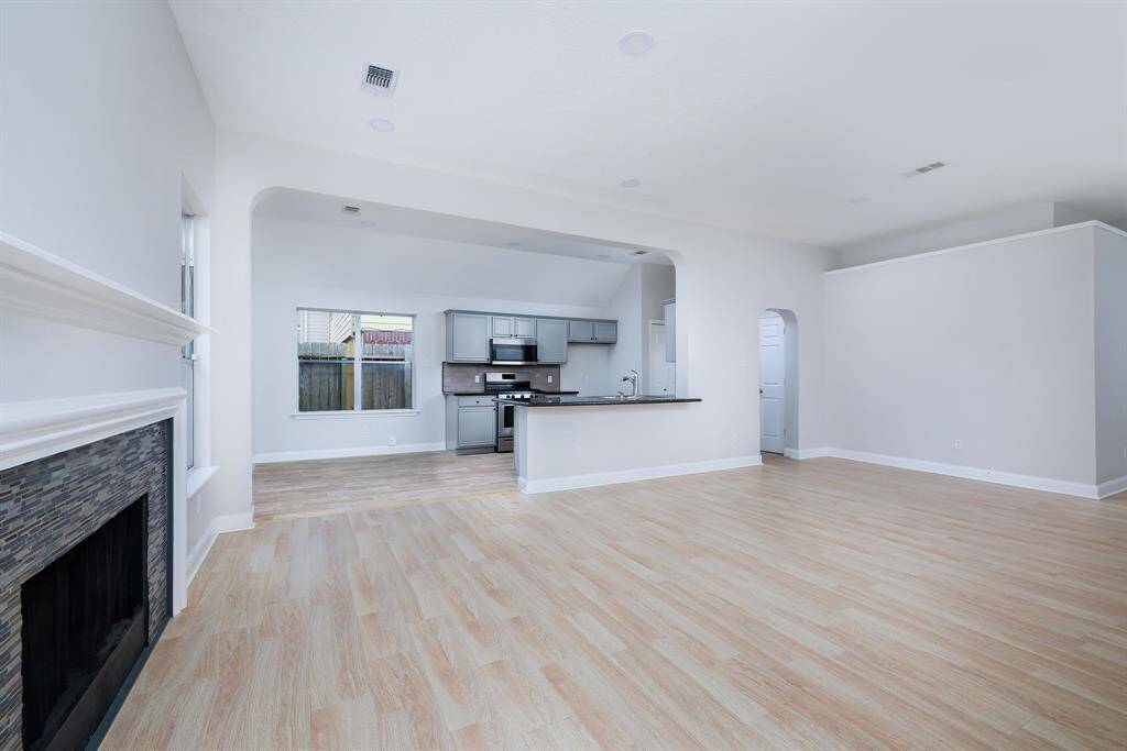 The living room connects to the kitchen and breakfast area. Light and bright yet cozy.