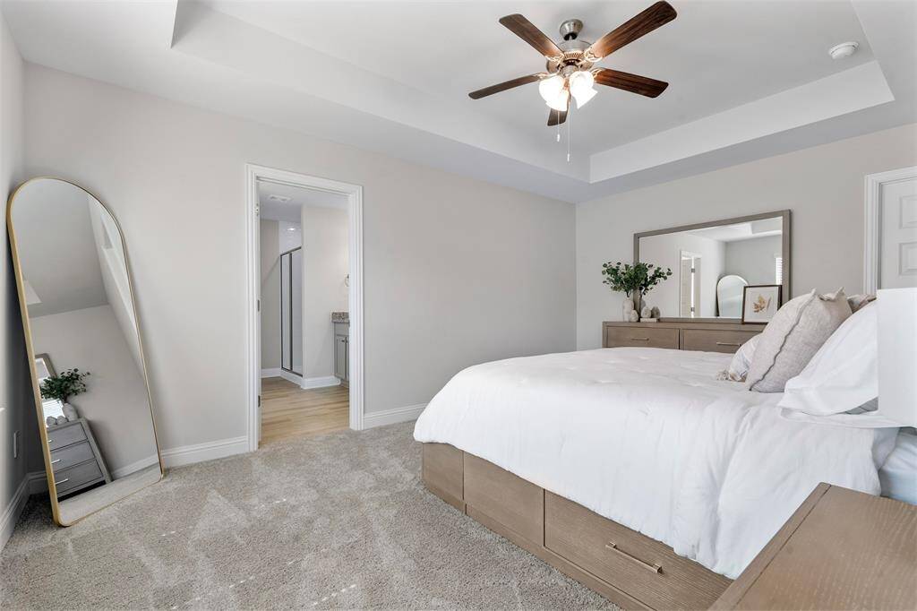The primary bedroom with tray ceiling