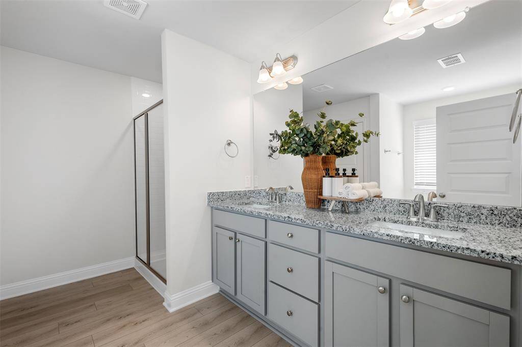 The primary bathroom has a separate shower & soaking tub