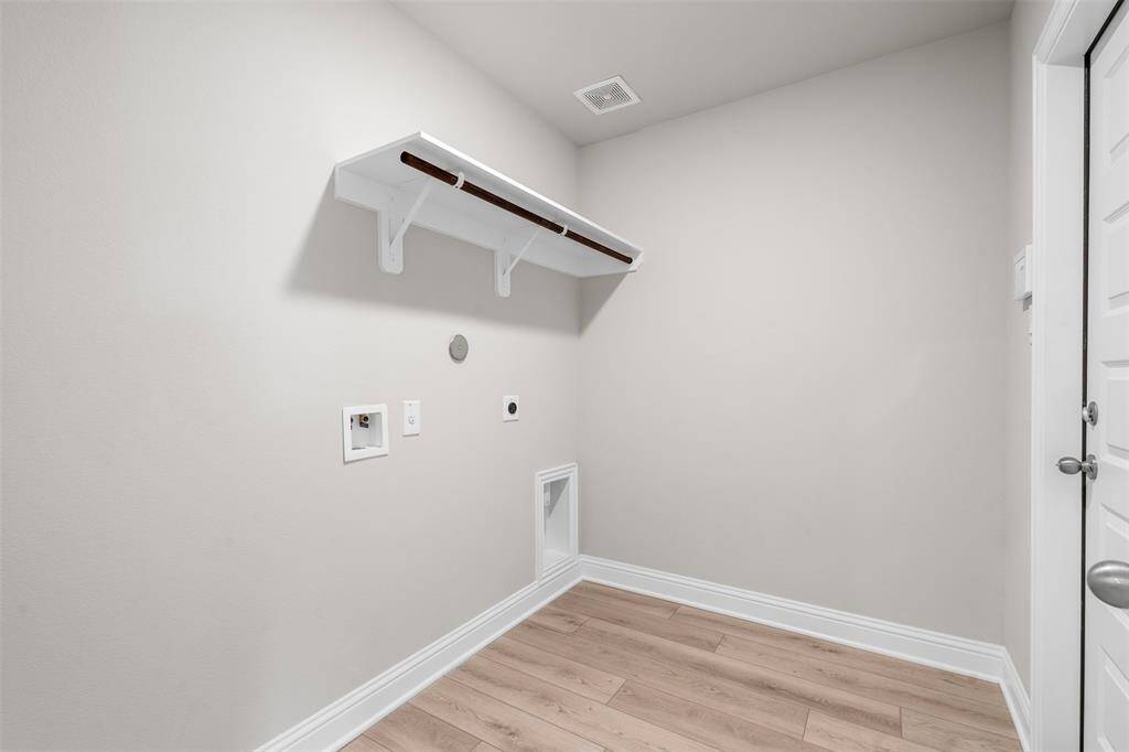The laundry room has access to the garage