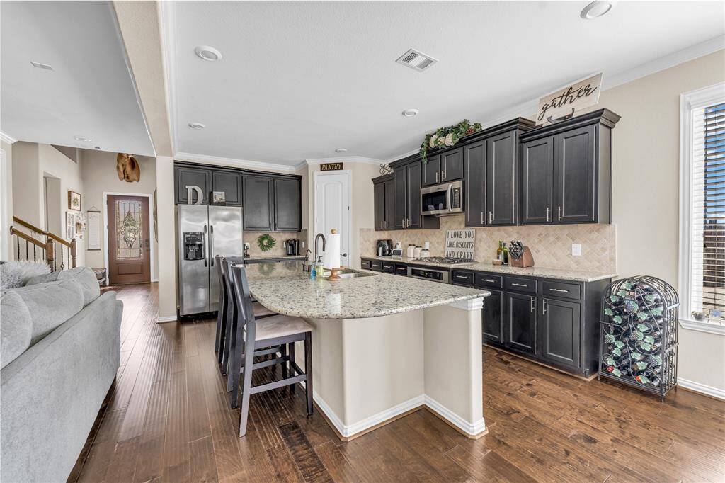 Kitchen offers plenty of counterspace for meal prepping and entertaining.