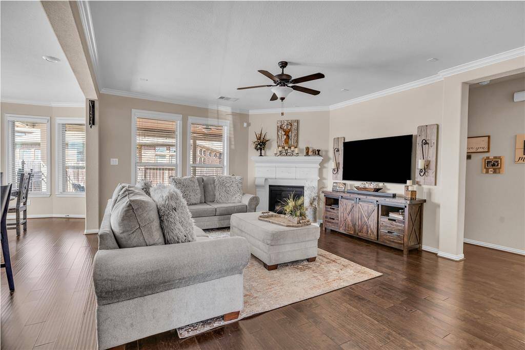 Open layout family room with lots of windows and natural light.