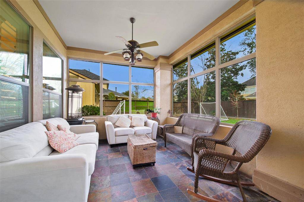 SUN ROOM WITH A VIEW OF BACKYARD PARADISE