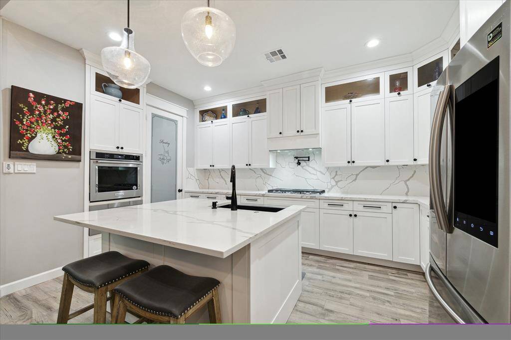 A kitchen island that will invite endless kitchen conversations and family  gatherings.