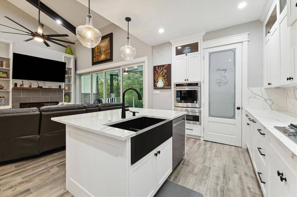 Apron-front sink can accommodate washing your largest pans and pot filler above the gas cook-top complete this dream of a kitchen. Be sure to check out the spacious walk-in pantry.