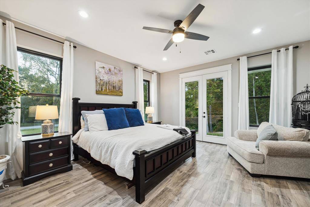 Primary retreat is your oasis to start and end each day. Private French doors lead to the rear patio.