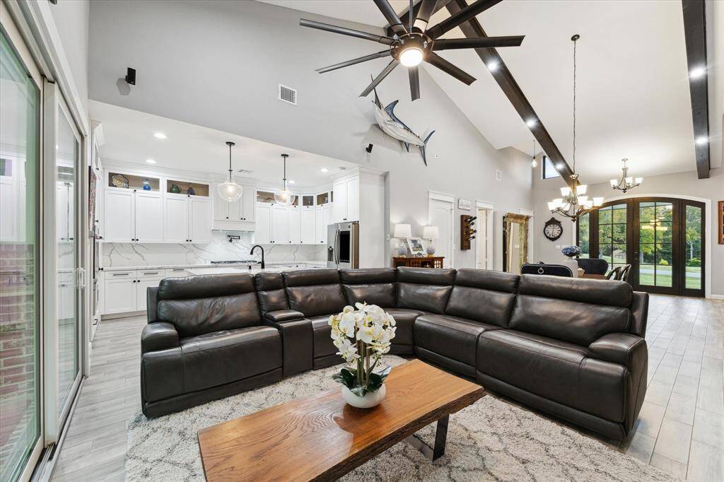 Family room adjoins the kitchen and dining space for true single-story living and flexibility.