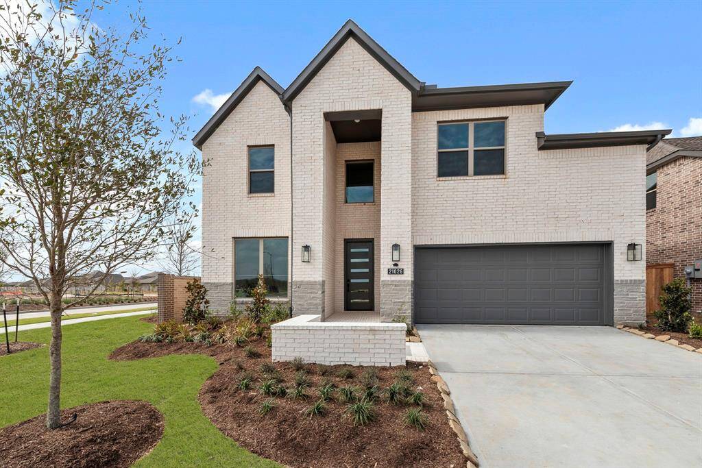 MOVE IN READY!! Westin Homes NEW Construction (Albany IX, Elevation K) Two story. 4 bedrooms. 3.5 baths. Green grass added to enhance photo.