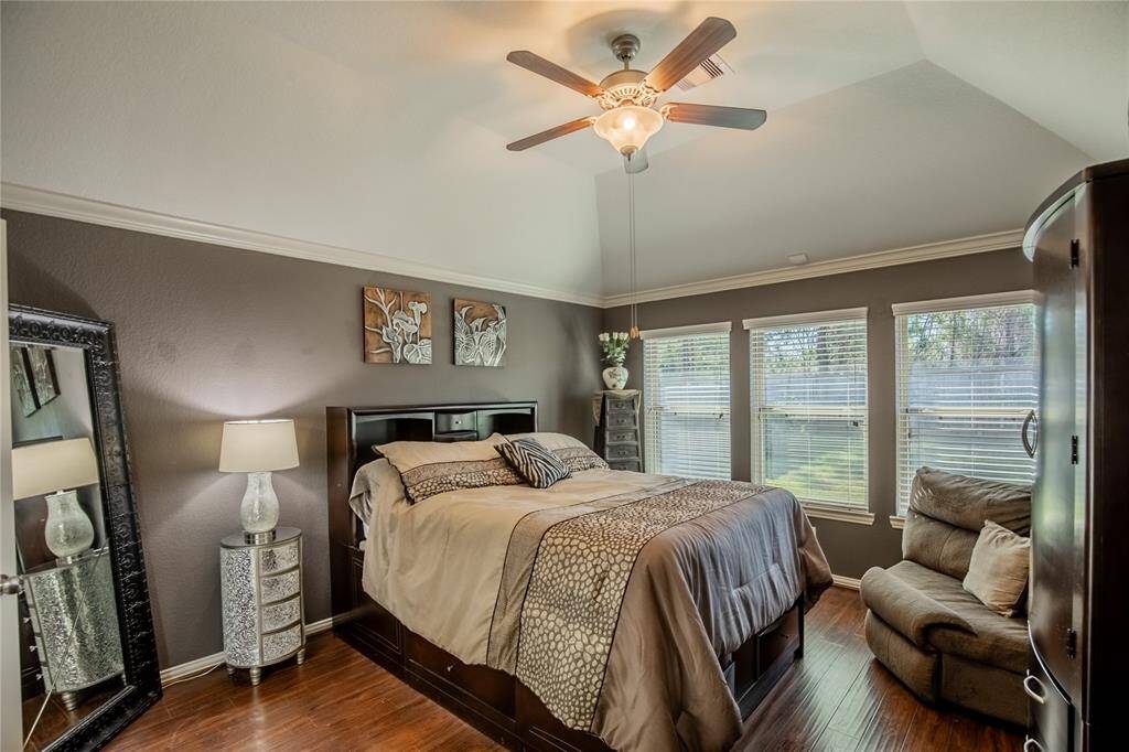 Sequestered Primary Suite also has large windows and lovely view of backyard