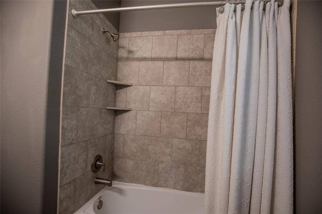 Shower/tub with tile surround in guest bath
