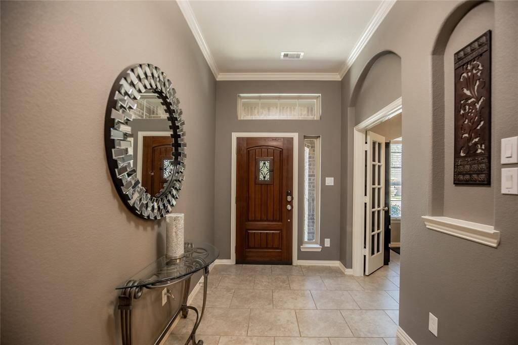 Beautiful crown molding and soothing tones carry throughout the home