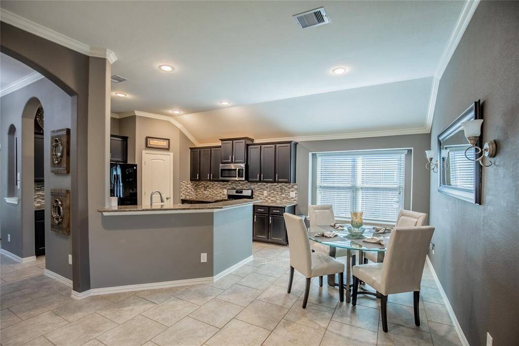 Spacious breakfast area off kitchen is roomy enough to accommodate even a large dining table