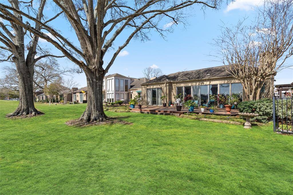 Enjoy breathtaking golf course views from this stunning home, featuring a spacious backyard with mature trees, a well-maintained lawn, and a charming wooden deck perfect for outdoor living. Don't miss this rare opportunity to own a home with such an incredible setting!