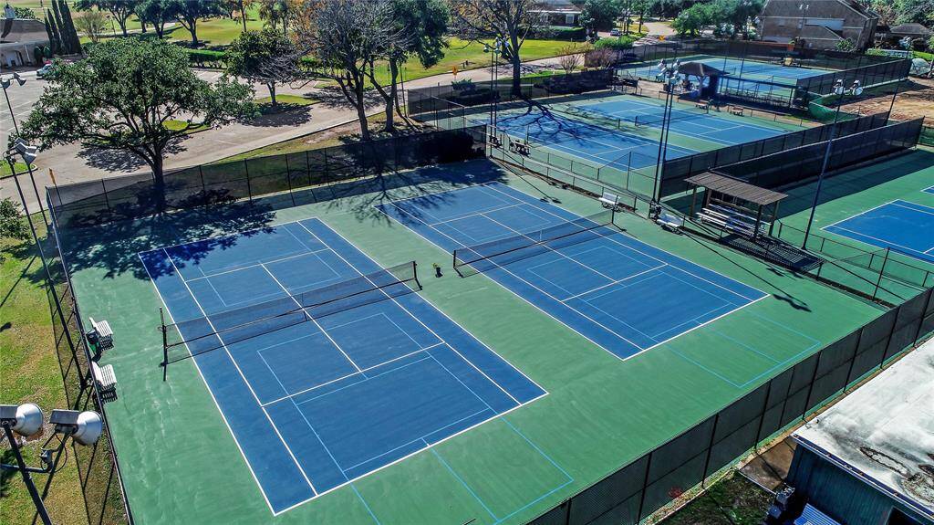 The tennis court at Sugar Creek is a beautifully maintained facility, perfect for both casual games and competitive matches. Surrounded by lush greenery, it provides a serene environment for residents to enjoy their game. The court's smooth surface and well-placed fencing offer a great playing experience for players of all skill levels, whether you're practicing your serve or engaging in a friendly match with friends or neighbors.