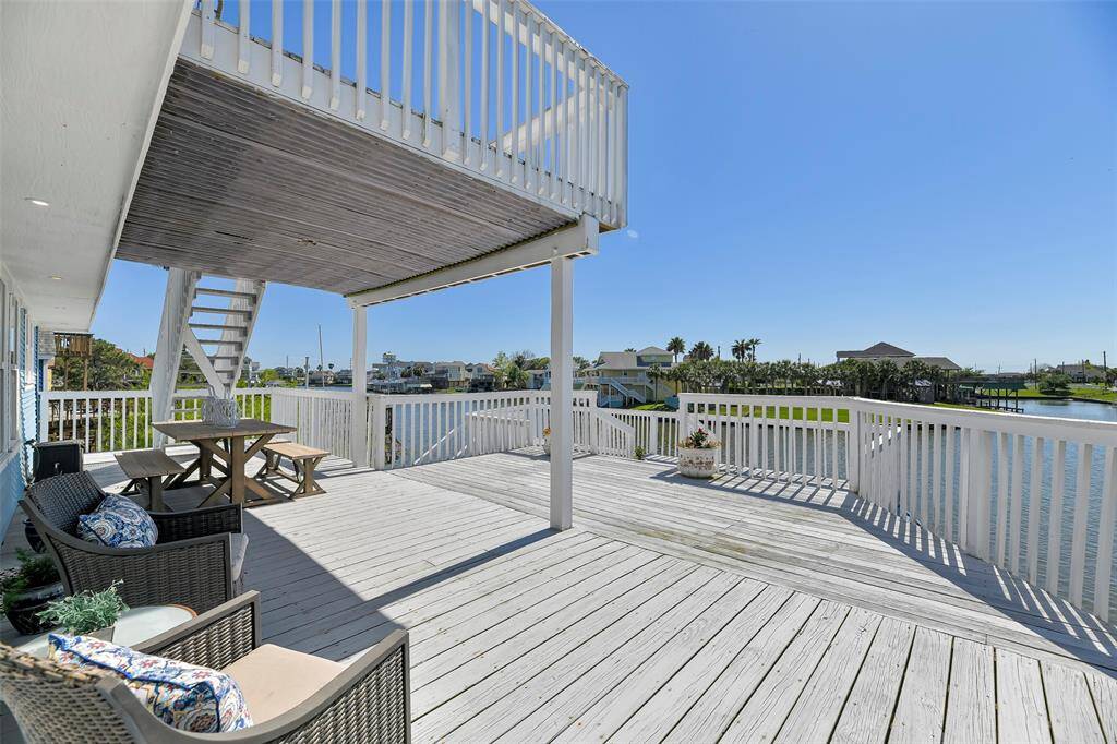 The spacious main level deck offers a covered and uncovered area.