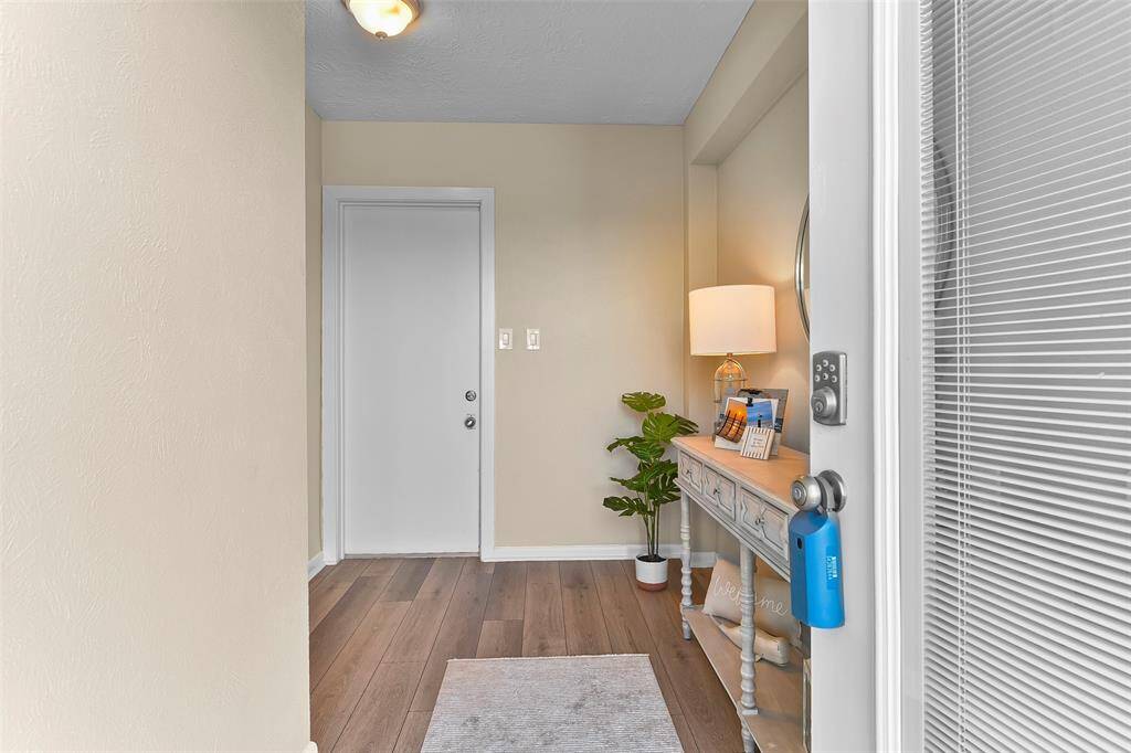 Formal entry to the home with elevator access or to the garage and back areas straight ahead.