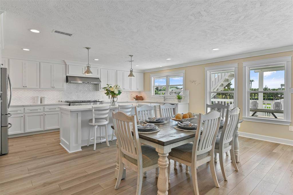The dining room is conveniently located between the living room & kitchen.