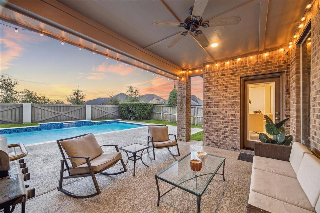 Enjoy dining or relaxing on this private, covered patio—your perfect outdoor retreat.