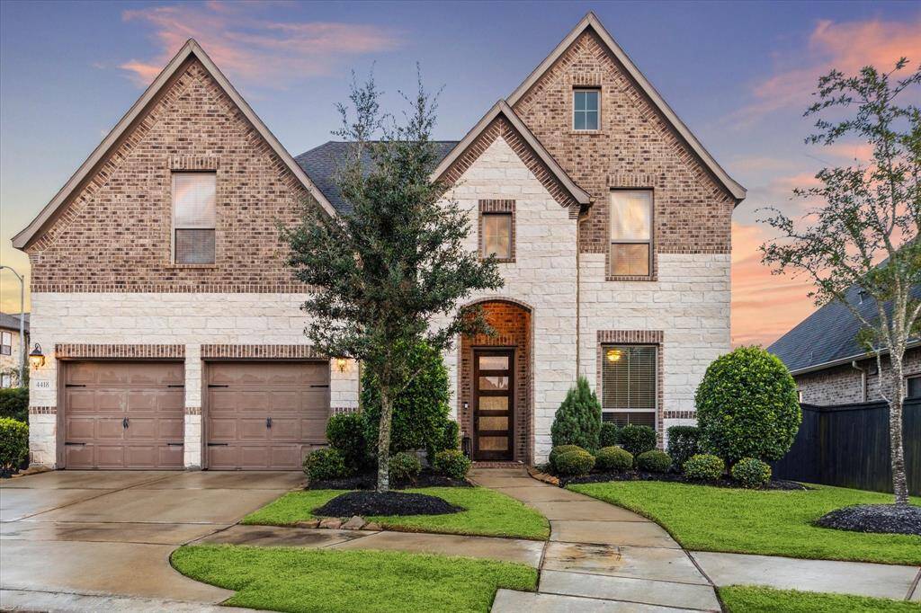 Discover your dream home at 4418 Million Bells Way in Harvest Green, Richmond, TX. Nestled in a private cul-de-sac, this stunning home features an elegant brick and stone exterior.