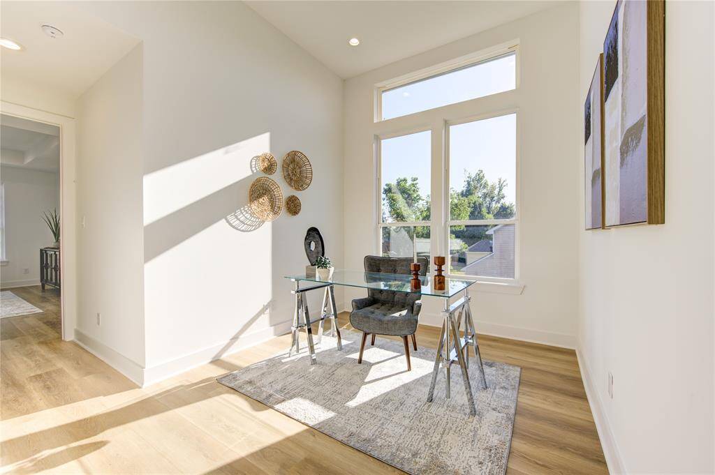 Bonus room features 12' tall ceilings with incredible natural lighting. A great space for a home office, game room, or a play area.