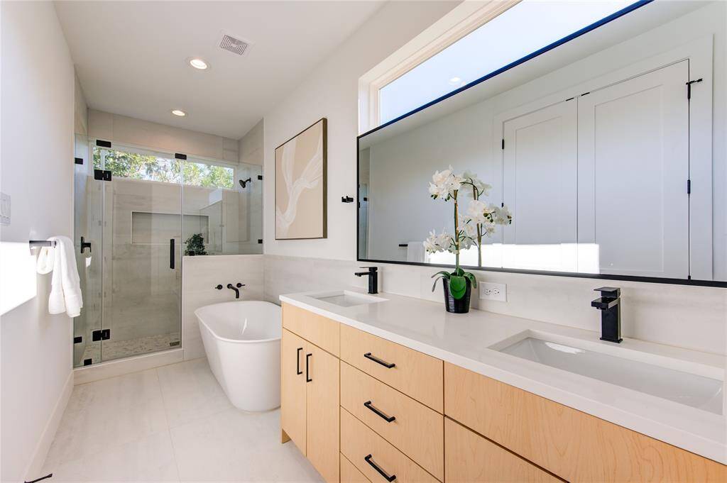 Primary bathroom features a freestanding soaking tub perfect for those stressful days