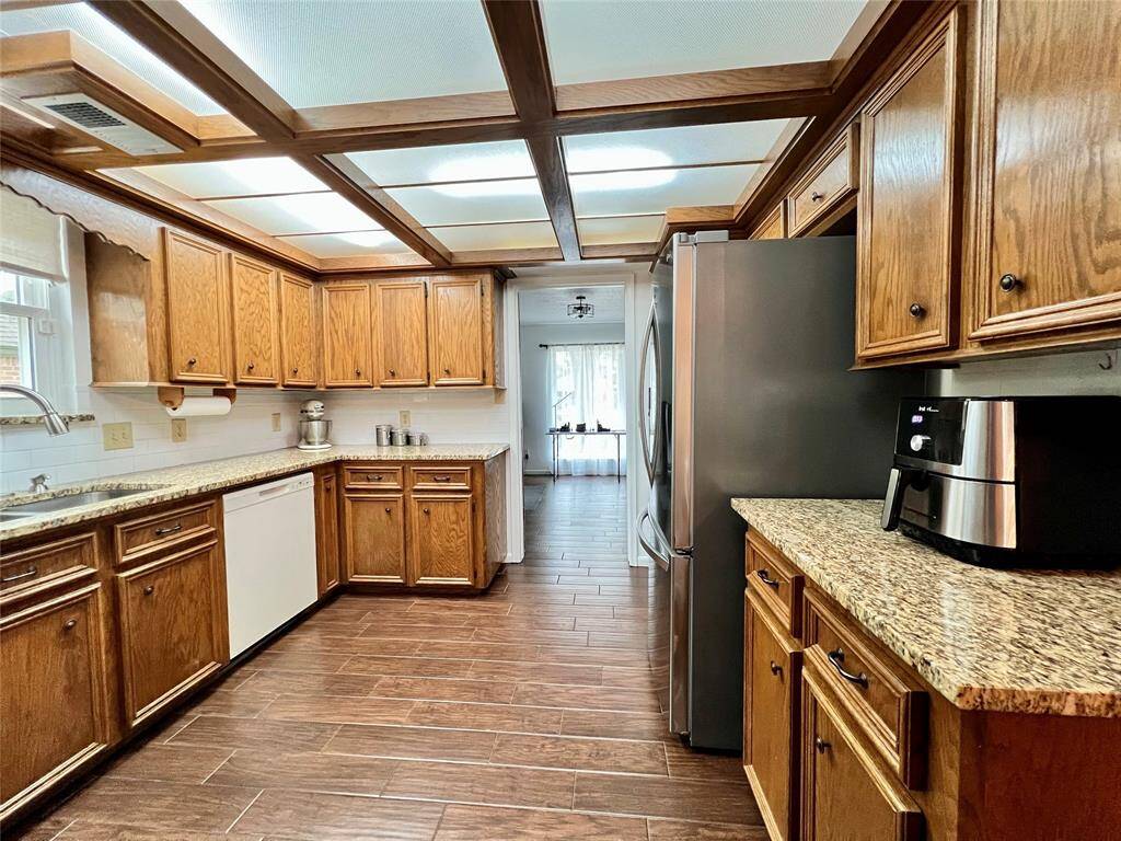 Kitchen with updated granite counters.