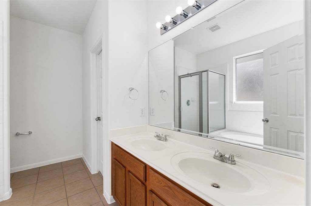 PRIMARY BATH w/Double Sinks, Oval Garden Tub & Separate Glass Shower